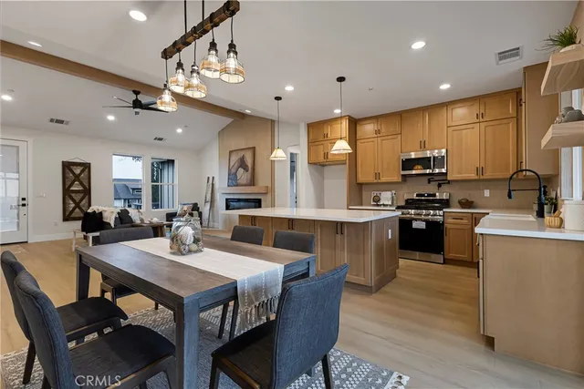 a kitchen with counter space appliances and a dining table