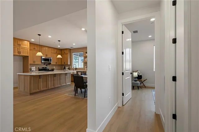 a kitchen with a refrigerator and a sink