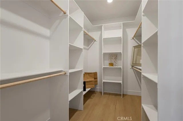 a room that has a bed and a chair in it