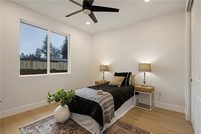 a spacious bedroom with a bed and a window