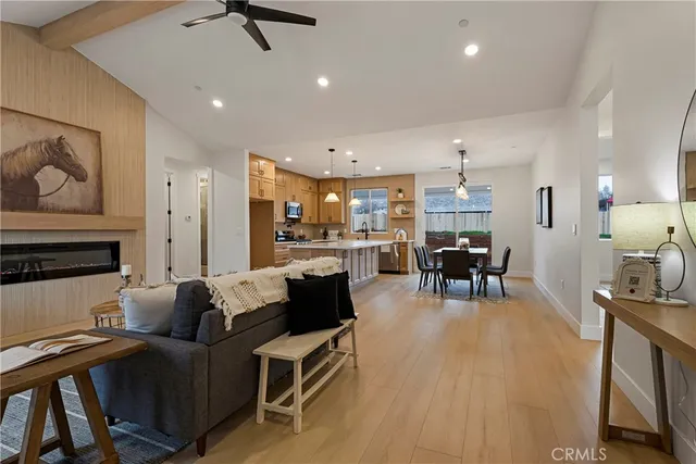 a living room with furniture and kitchen view