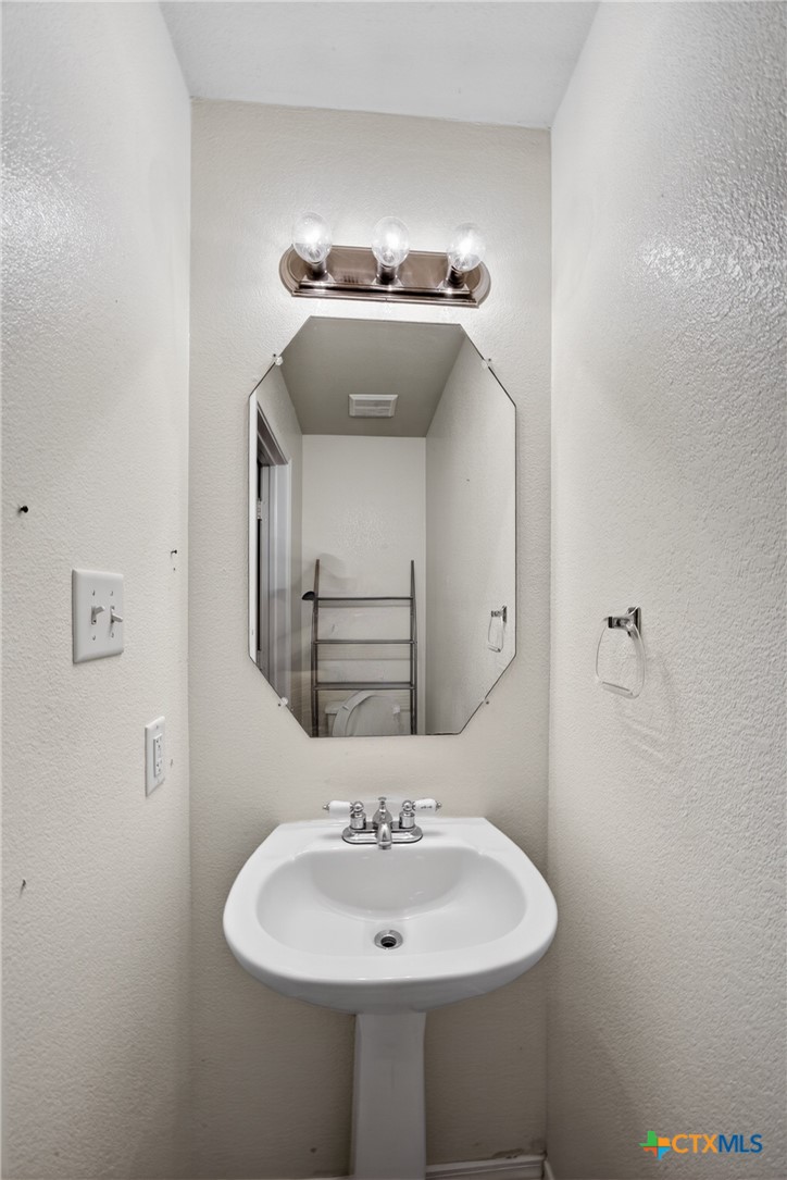 7015 Rickey Drive Temple, TX 76502 - Photo 13 of 29 a bathroom with a sink and a mirror