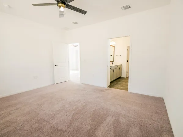 a view of empty room with fireplace