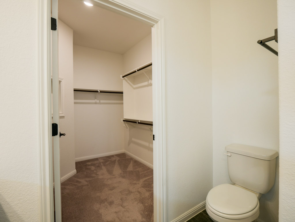 103 Kitty Hawk Road Georgetown, TX 78633 - Photo 23 of 34 a white toilet sitting next to a shower