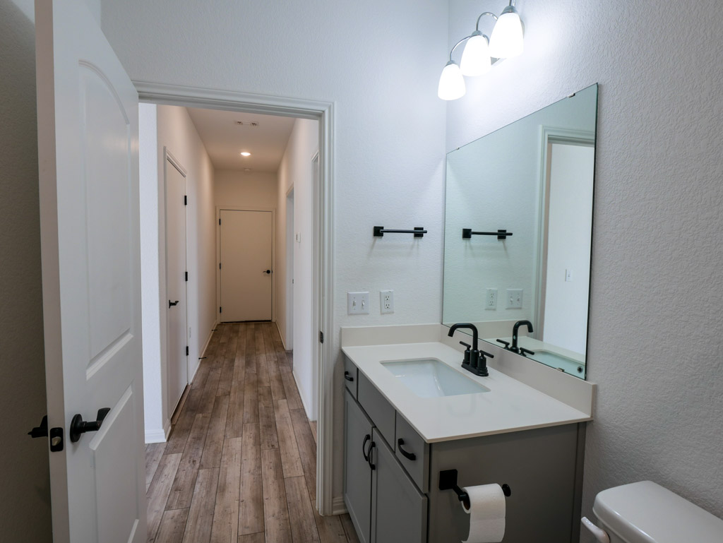 103 Kitty Hawk Road Georgetown, TX 78633 - Photo 29 of 34 a bathroom with a sink a toilet and shower