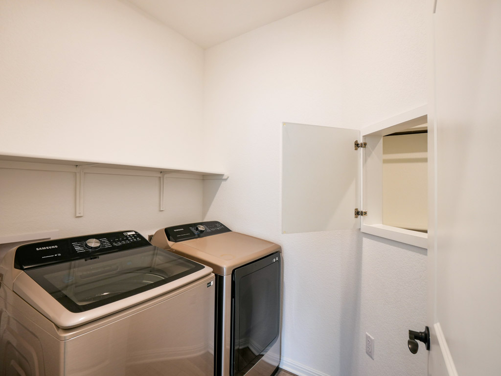 103 Kitty Hawk Road Georgetown, TX 78633 - Photo 30 of 34 a utility room with dryer and washer