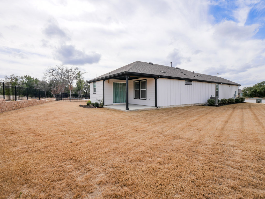 103 Kitty Hawk Road Georgetown, TX 78633 - Photo 32 of 34 a front view of house with yard and trees