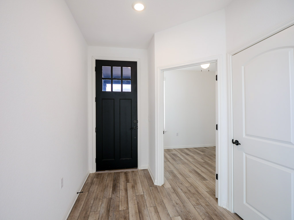 103 Kitty Hawk Road Georgetown, TX 78633 - Photo 5 of 34 a view of a hallway with wooden floor