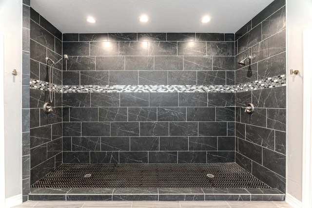 a bedroom with two beds and a window