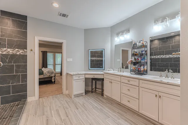 a bedroom with a bed and flat screen tv