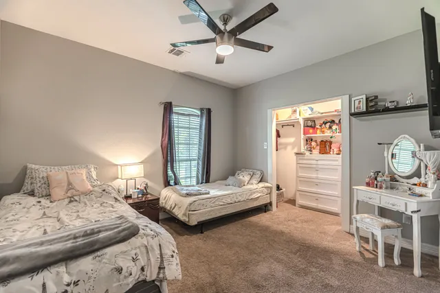 a bathroom with a granite countertop sink a shower and a mirror