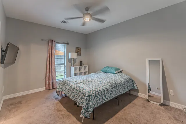 a spacious bathroom with a double vanity sink mirror and double