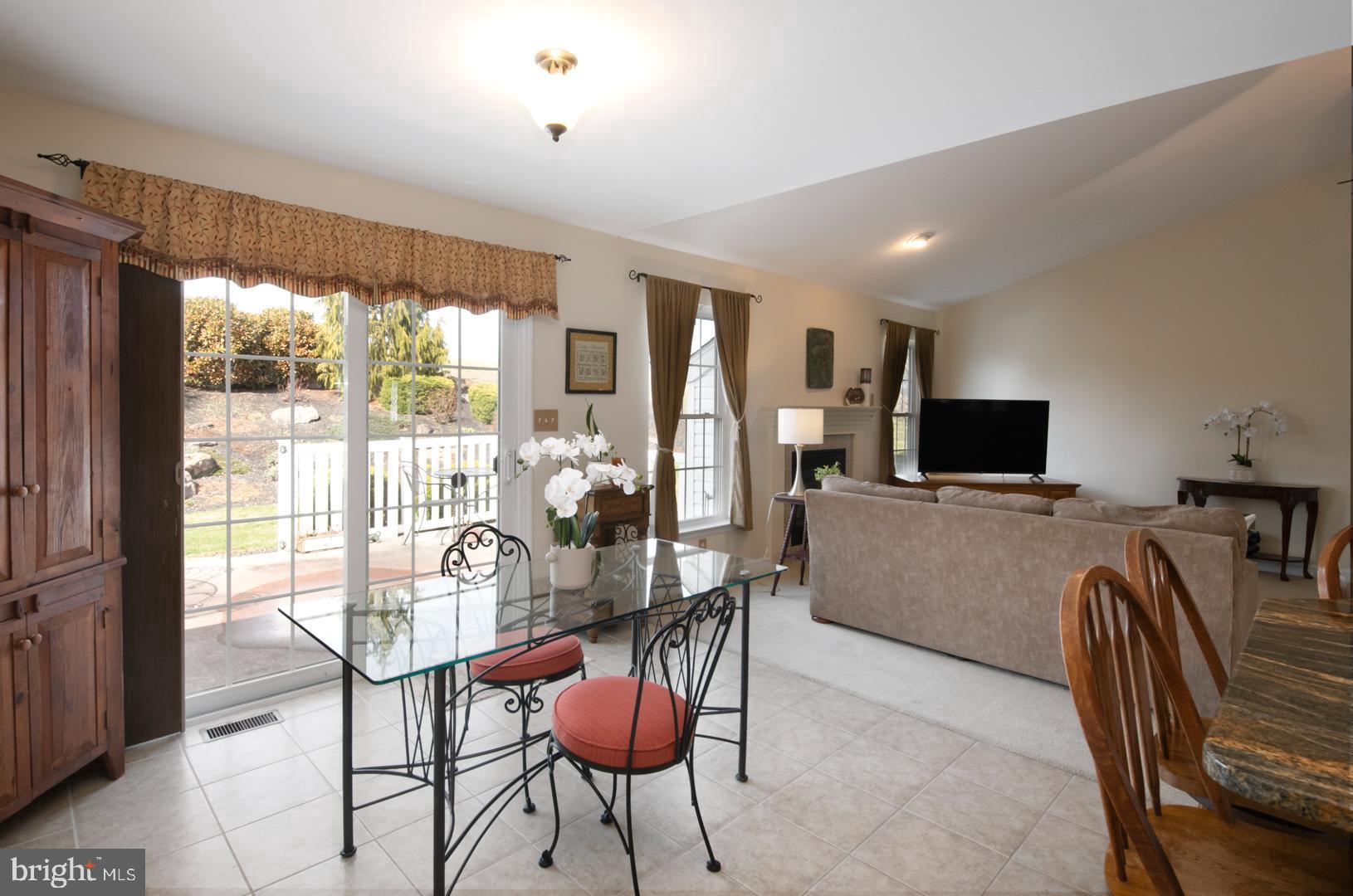382 Tilden Road Mohrsville, PA 19541 - Photo 13 of 34 a living room with furniture a flat screen tv and a large window