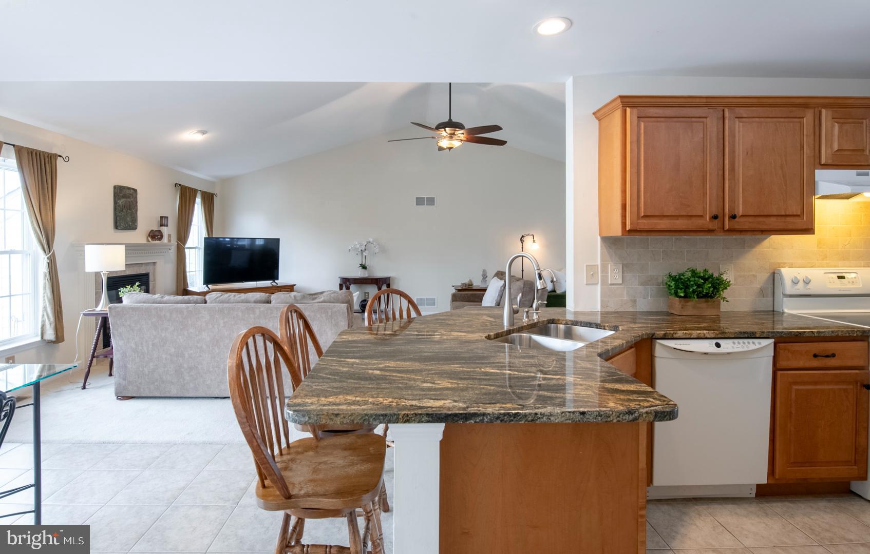 382 Tilden Road Mohrsville, PA 19541 - Photo 14 of 34 a kitchen with kitchen island granite countertop a table chairs sink and cabinets