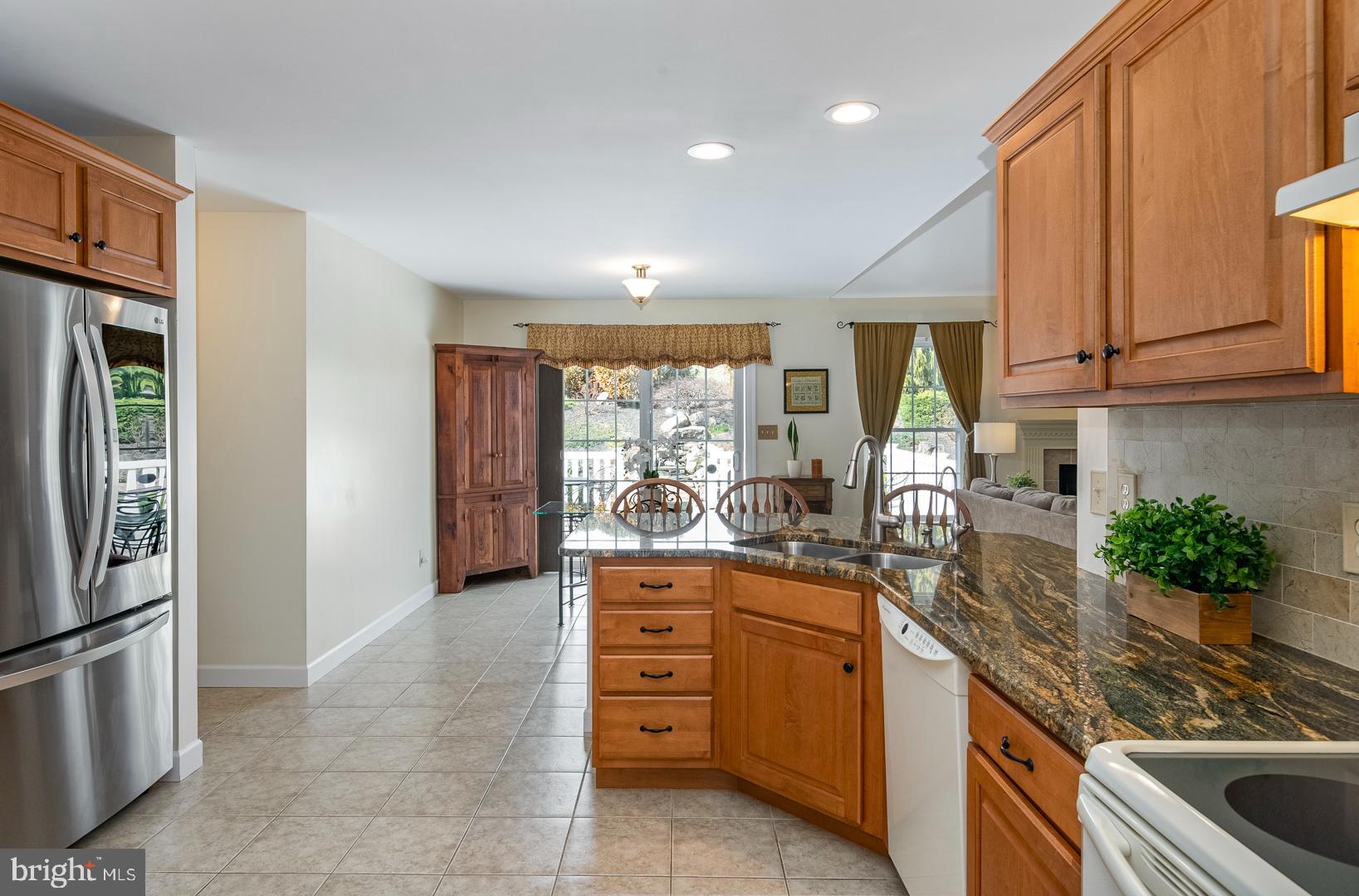 382 Tilden Road Mohrsville, PA 19541 - Photo 16 of 34 a kitchen with stainless steel appliances granite countertop a stove a sink and a refrigerator