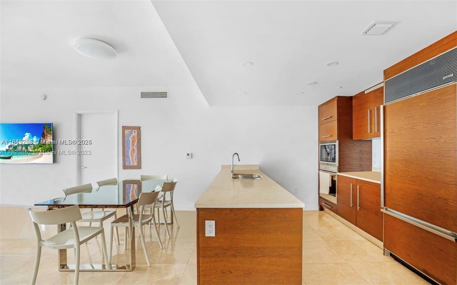 475 Brickell Avenue, Unit 4909 Miami, FL 33131 - Photo 3 of 9 a living room with furniture and wooden floor