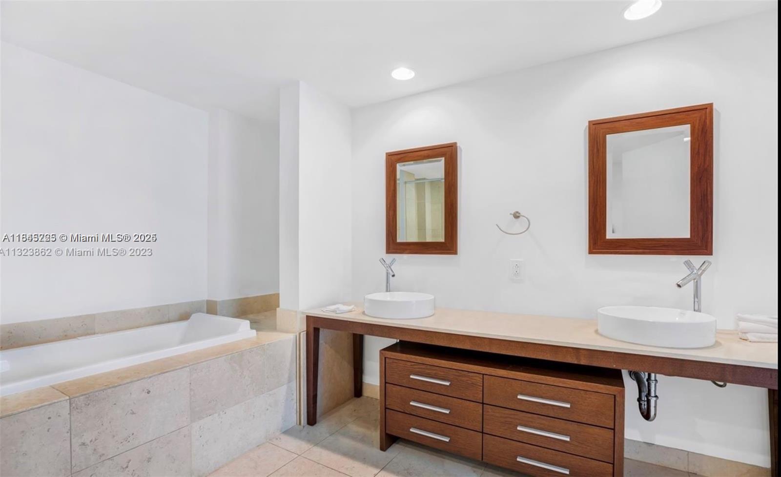 475 Brickell Avenue, Unit 4909 Miami, FL 33131 - Photo 9 of 9 a bathroom with a sink and a bathtub