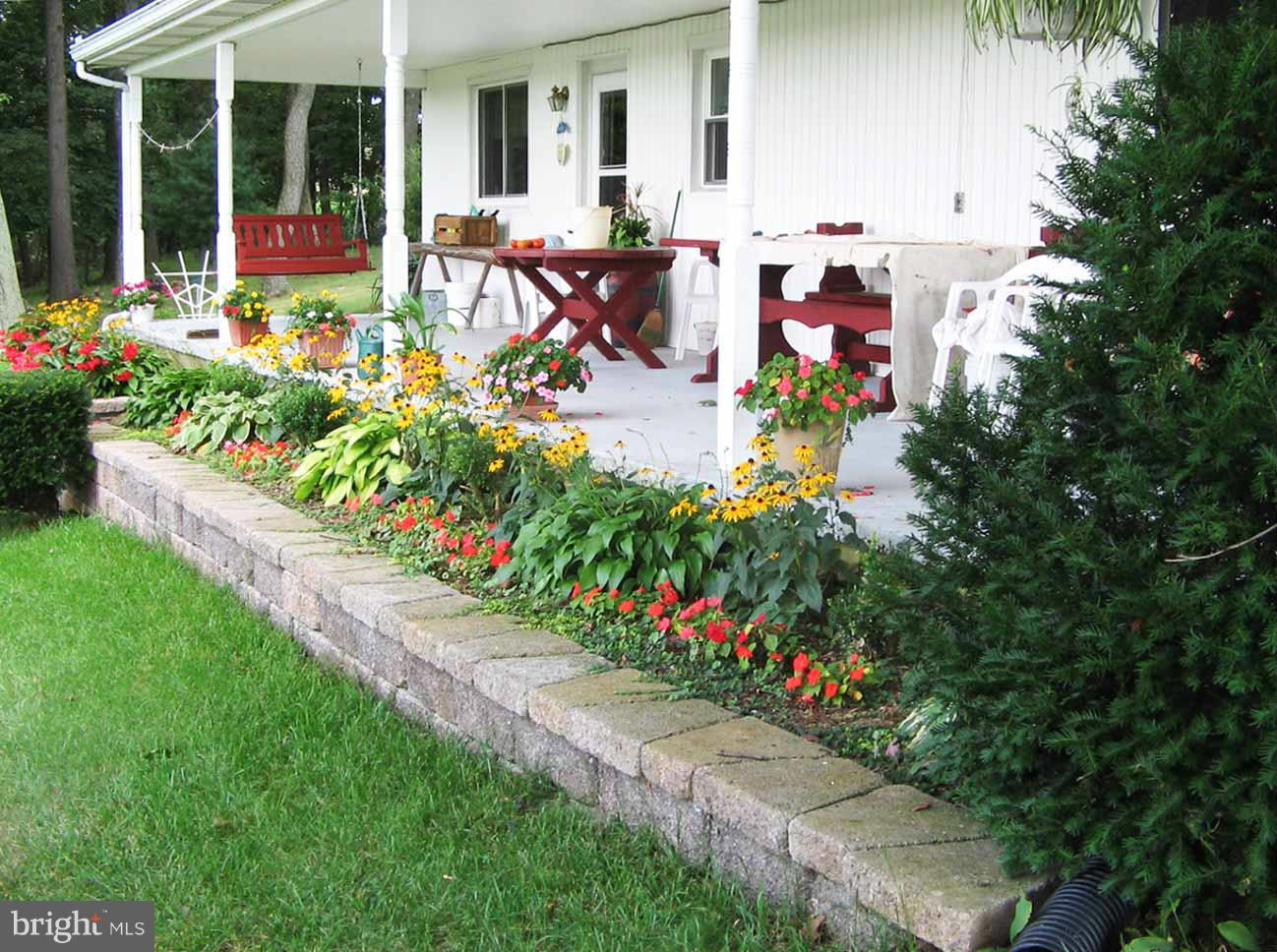 3548 Water Tank Road Manchester, MD 21102 - Photo 22 of 30 a picture of flowers in front of house