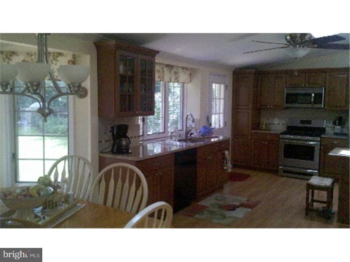 129 Kitty Hawk Road Cherry Hill, NJ 08034 - Photo 2 of 12 a kitchen with a sink cabinets and window
