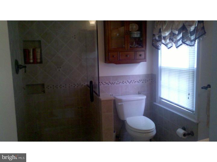 129 Kitty Hawk Road Cherry Hill, NJ 08034 - Photo 12 of 12 a bathroom with a sink and a toilet