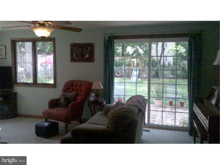 129 Kitty Hawk Road Cherry Hill, NJ 08034 - Photo 3 of 12 a living room with furniture and a flat screen tv