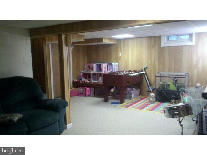 129 Kitty Hawk Road Cherry Hill, NJ 08034 - Photo 4 of 12 a living room with furniture and a flat screen tv
