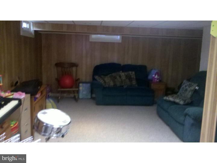 129 Kitty Hawk Road Cherry Hill, NJ 08034 - Photo 5 of 12 a living room with furniture and a fireplace