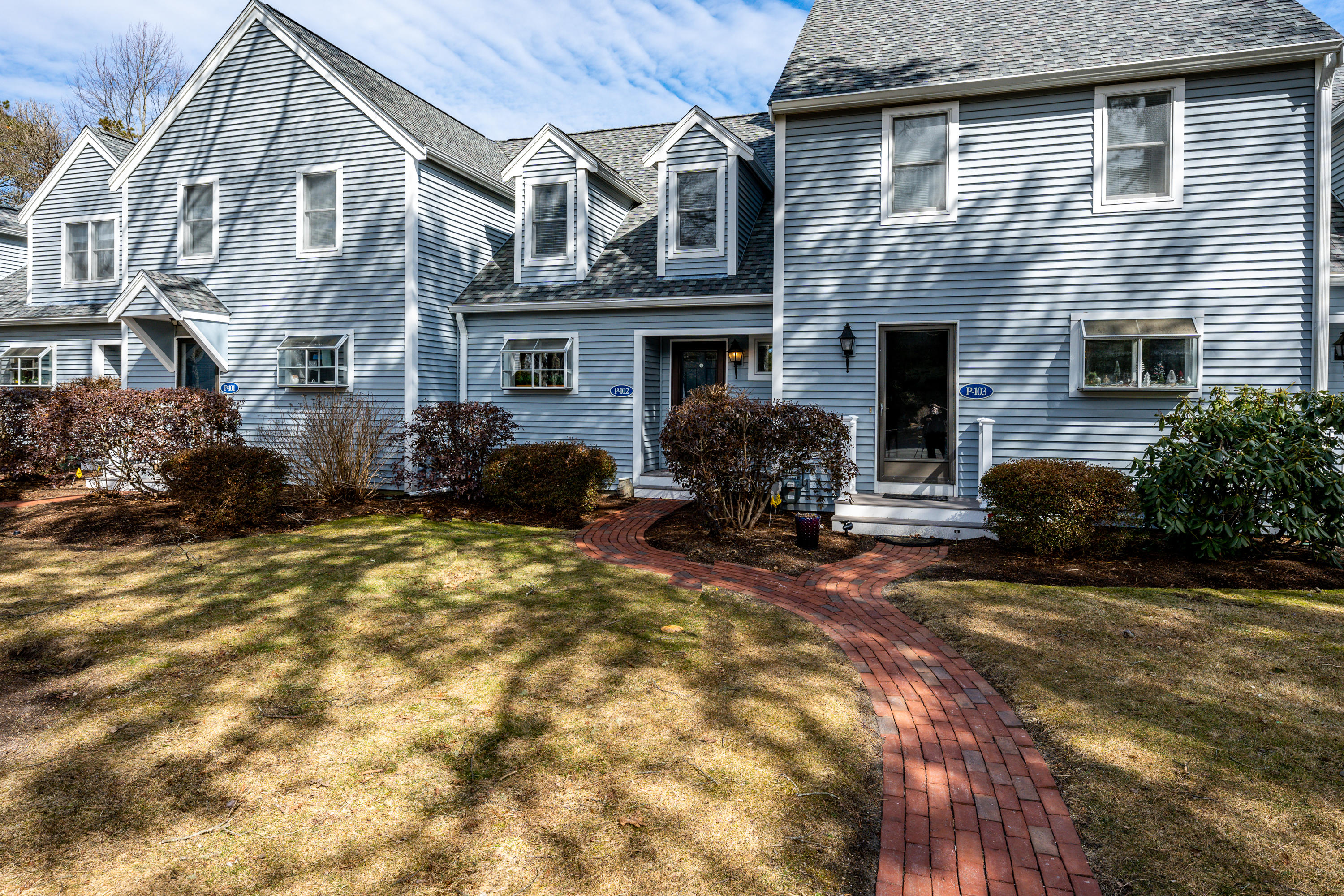 102 Shellback Way, Unit P 102 Mashpee, MA 02649 - Photo 1 of 29 Front View with Brick Walkway