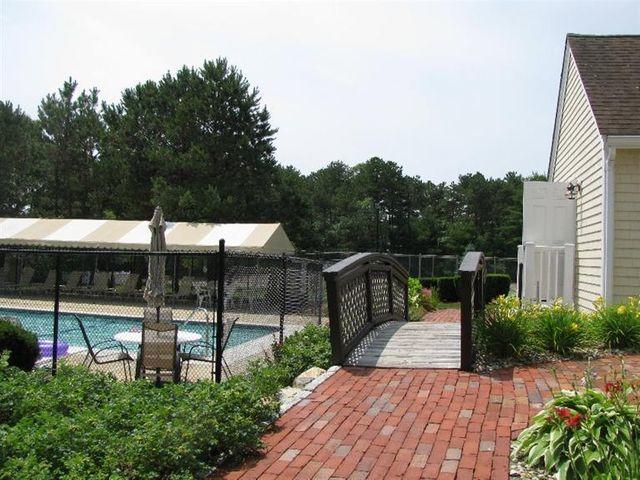 102 Shellback Way, Unit P 102 Mashpee, MA 02649 - Photo 25 of 29 Walkway to Pool & Tennis court