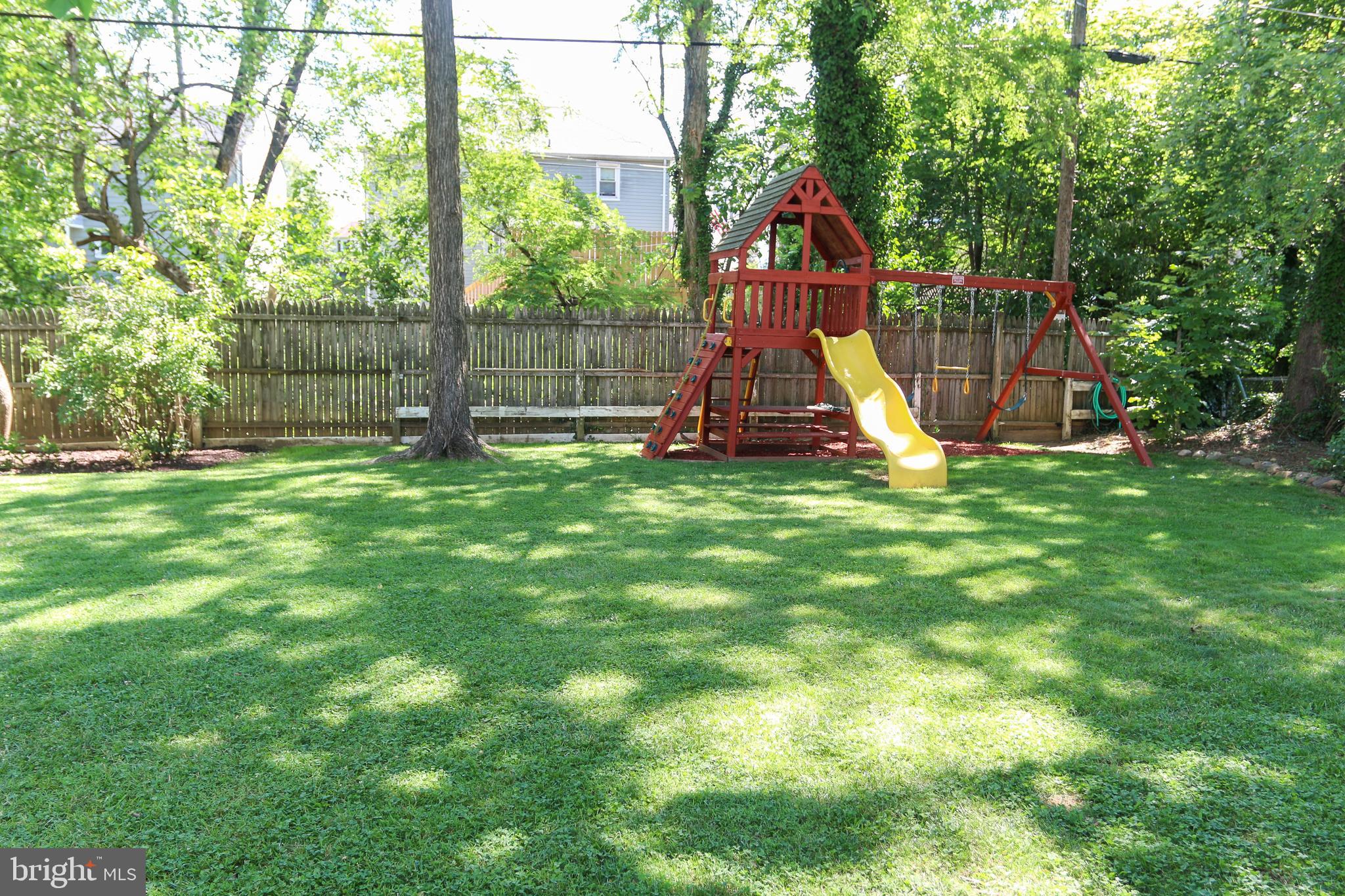 5517 Ashbourne Road Halethorpe, MD 21227 - Photo 30 of 38 Level yard with playground equipment
