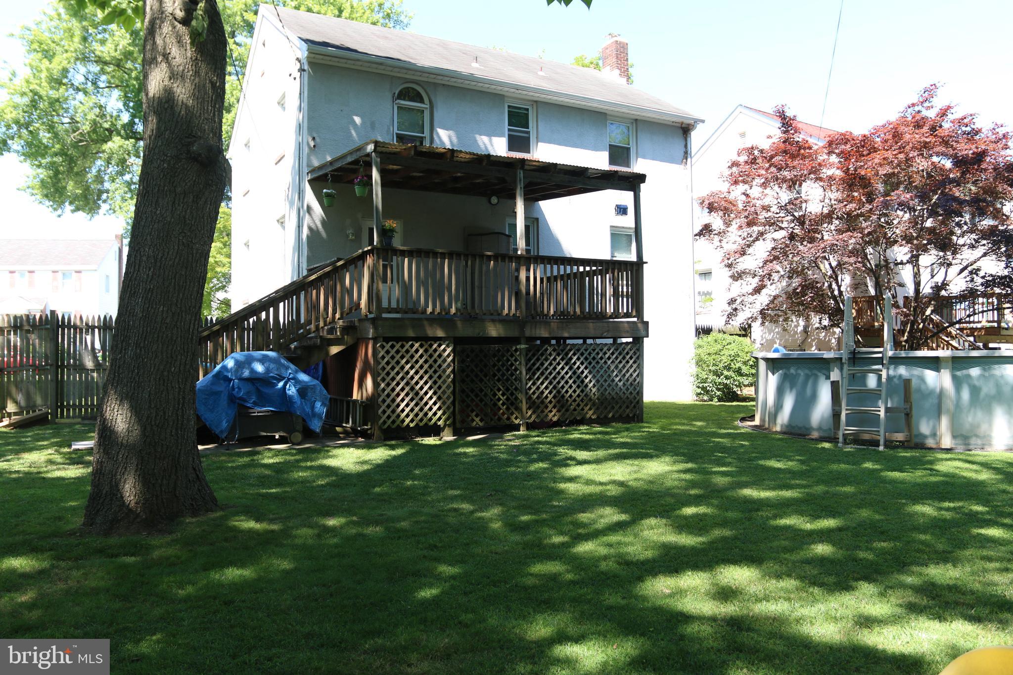 5517 Ashbourne Road Halethorpe, MD 21227 - Photo 35 of 38 Rear view of house with covered deck.