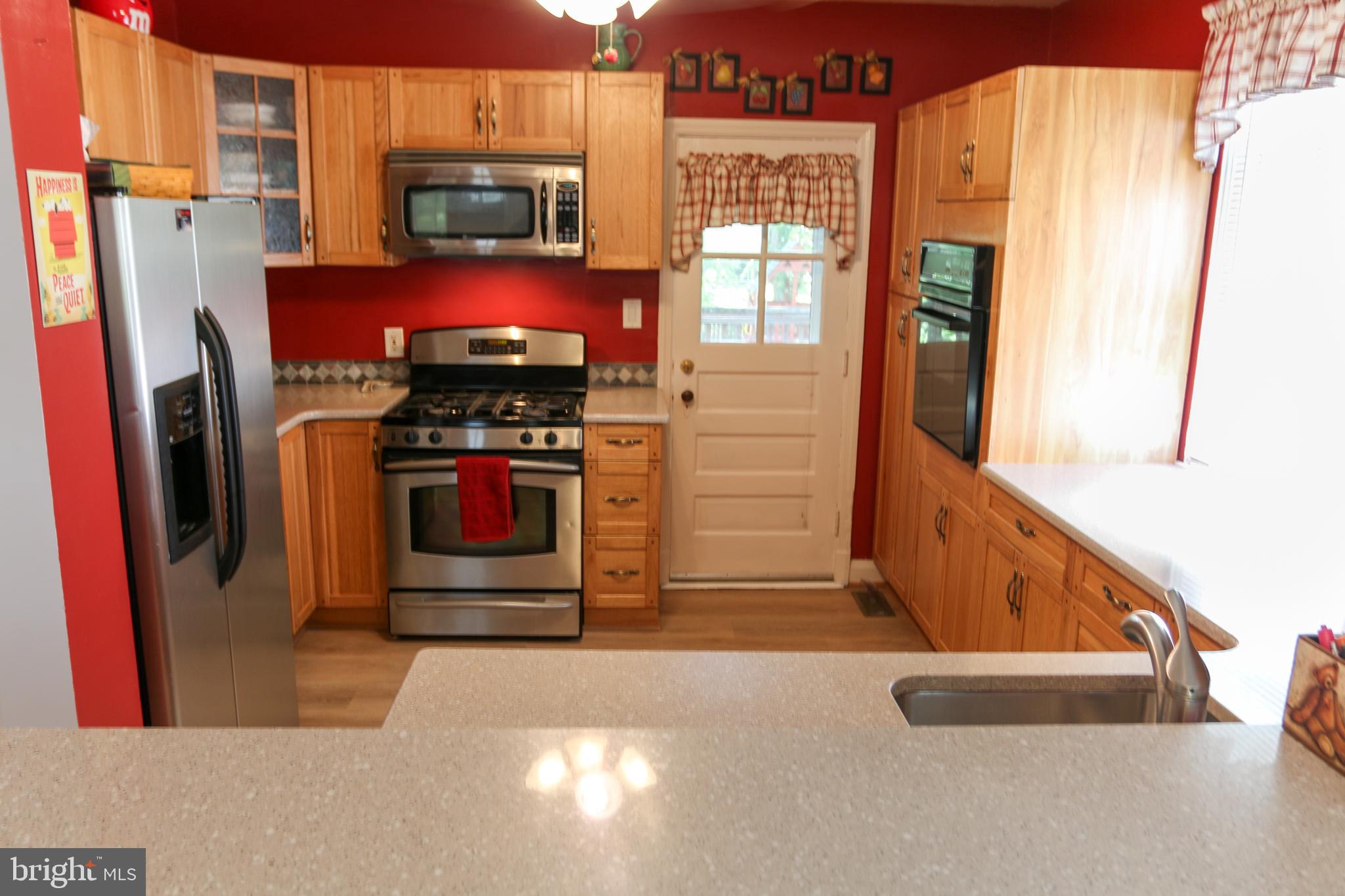 5517 Ashbourne Road Halethorpe, MD 21227 - Photo 5 of 38 Kitchen with bar passing through to dining room