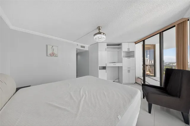 a bedroom with a bed and a table