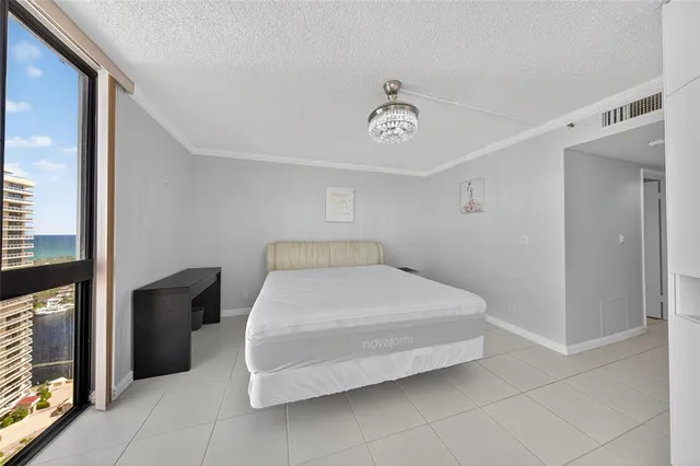 a bedroom with a bed and a table