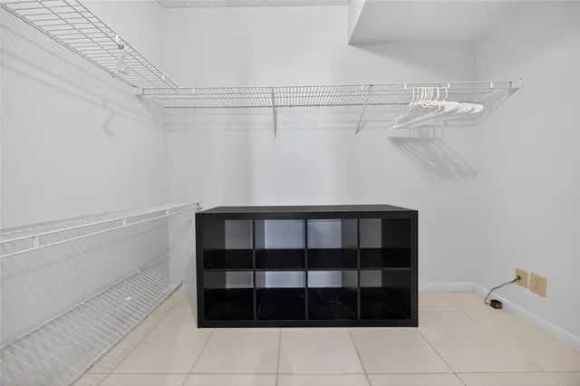 a spacious bathroom with a granite countertop sink mirror vanity and toilet