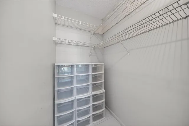 a living room with table and chairs