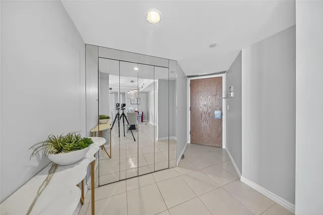 a spacious bedroom with a bed and large windows