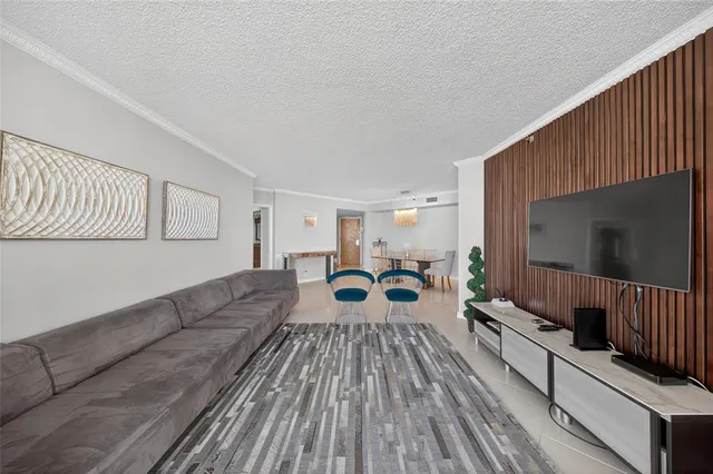 a view of a couches with potted plants