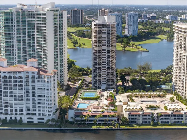 a bedroom with a bed and large glass window