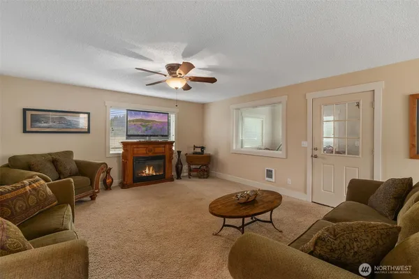 a bed sitting in a bedroom next to a lamp