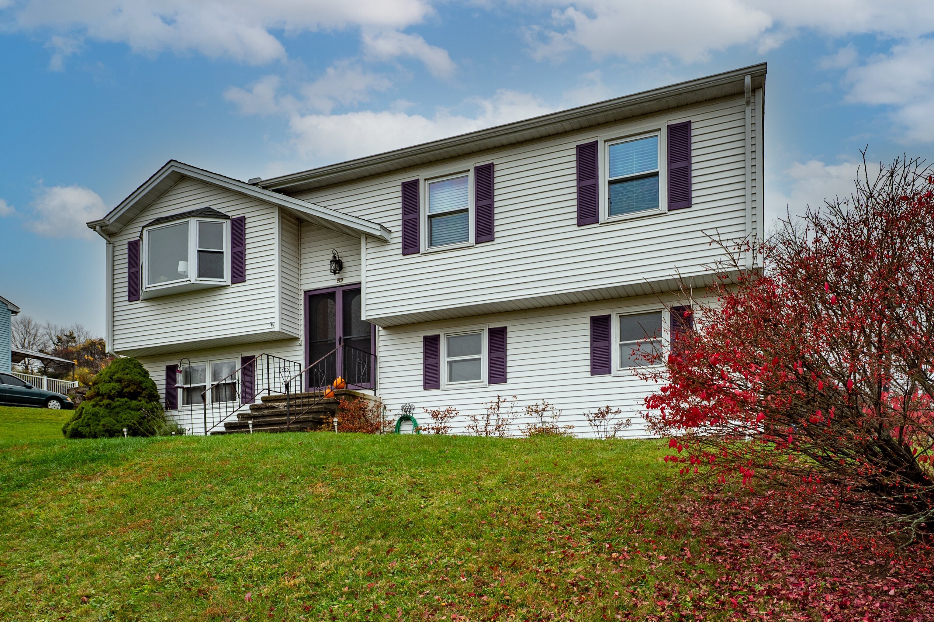 52 Cimarron Road Middletown, CT 06457 - Photo 1 of 31 a front view of house with yard and green space