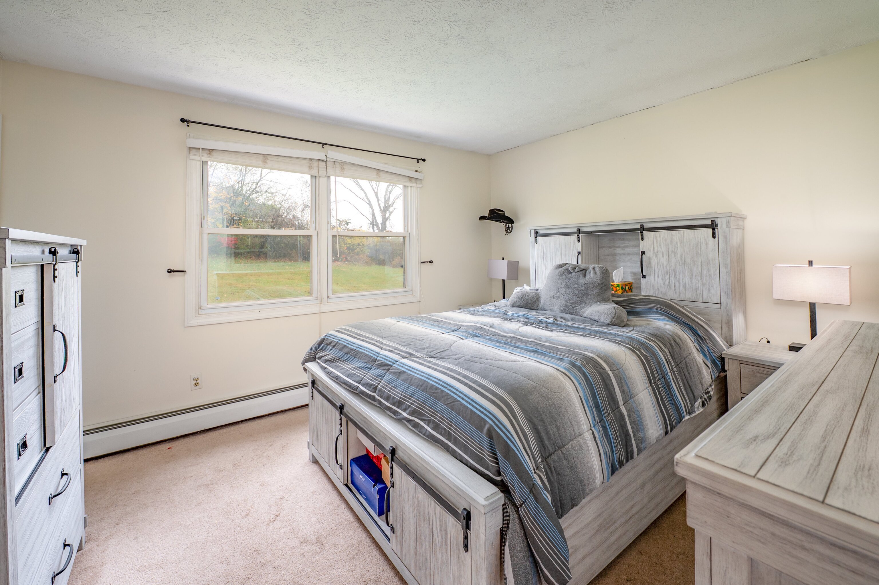 52 Cimarron Road Middletown, CT 06457 - Photo 17 of 31 a bedroom with a bed and a large window