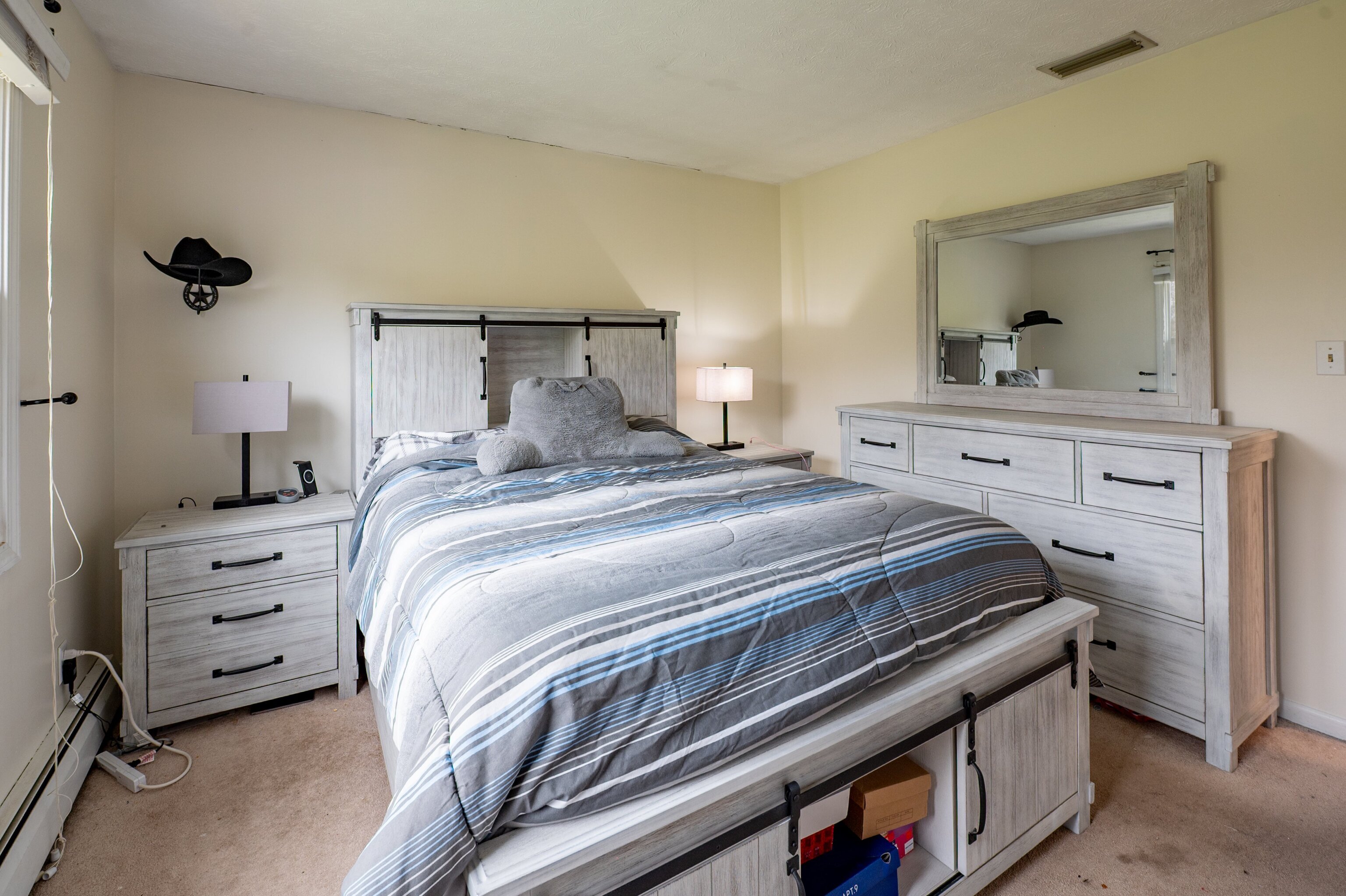 52 Cimarron Road Middletown, CT 06457 - Photo 18 of 31 a bedroom with a bed and a dresser