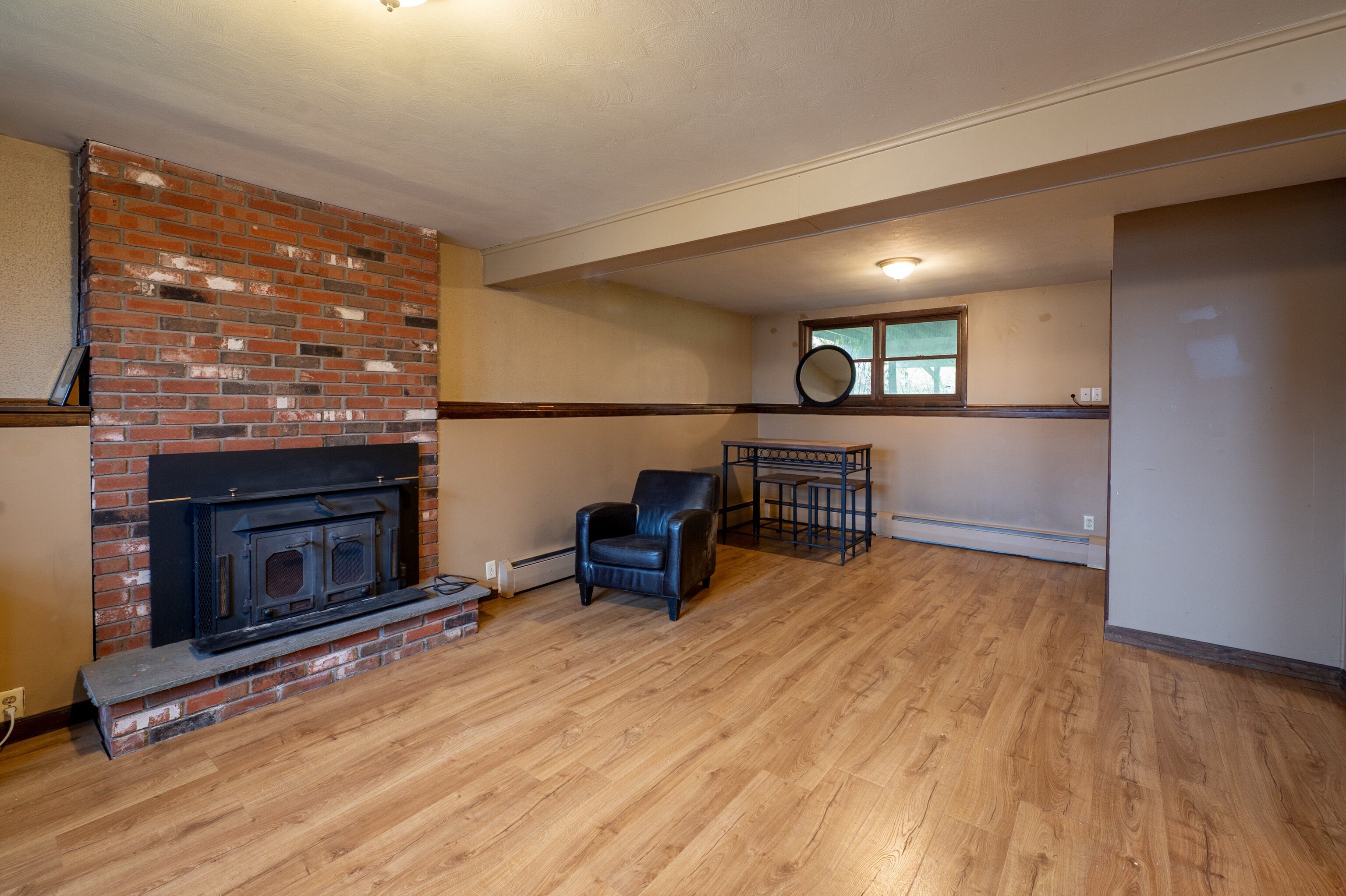 52 Cimarron Road Middletown, CT 06457 - Photo 21 of 31 a kitchen with stainless steel appliances wooden floor and a fireplace