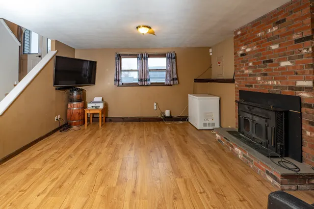 a living room with a flat screen tv and a fireplace