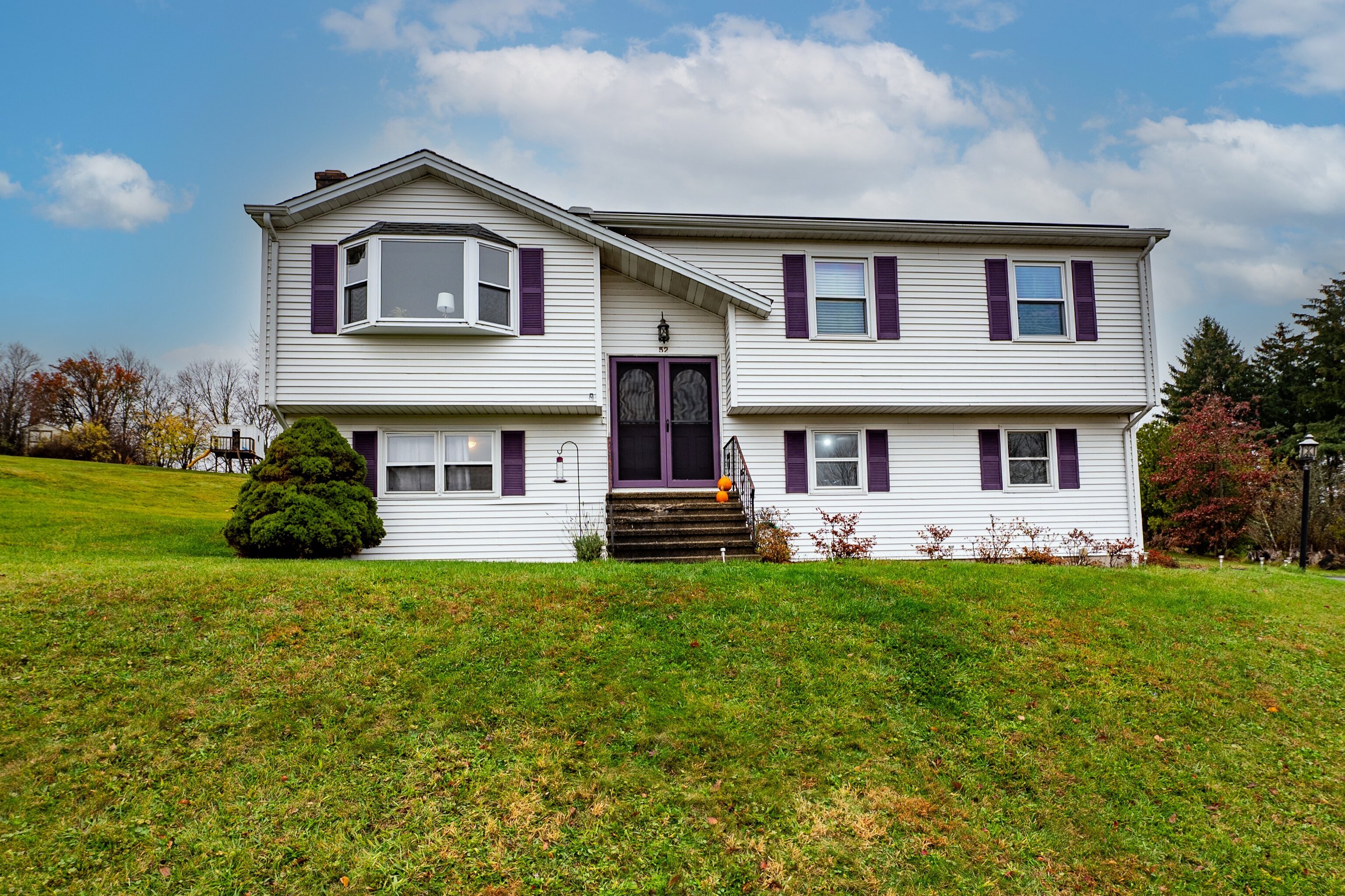 52 Cimarron Road Middletown, CT 06457 - Photo 3 of 31 a front view of a house with a garden
