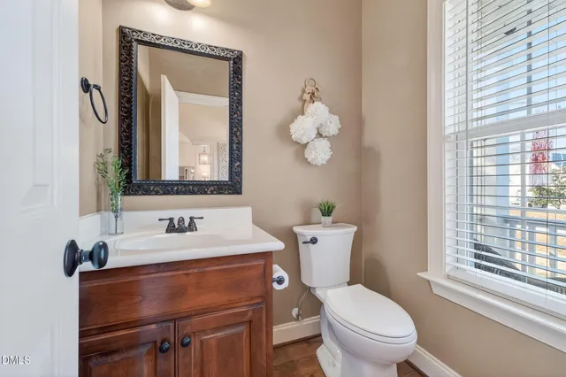 a bath tub sitting in a bathroom next to a window