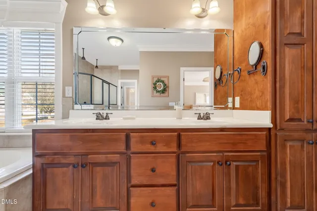 a bedroom with a bed closet and a ceiling fan
