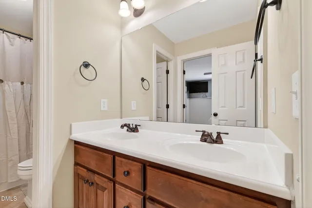 a living room with furniture and a ceiling fan