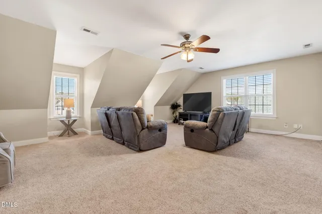 a view of a deck with table and chairs with wooden floor and fence